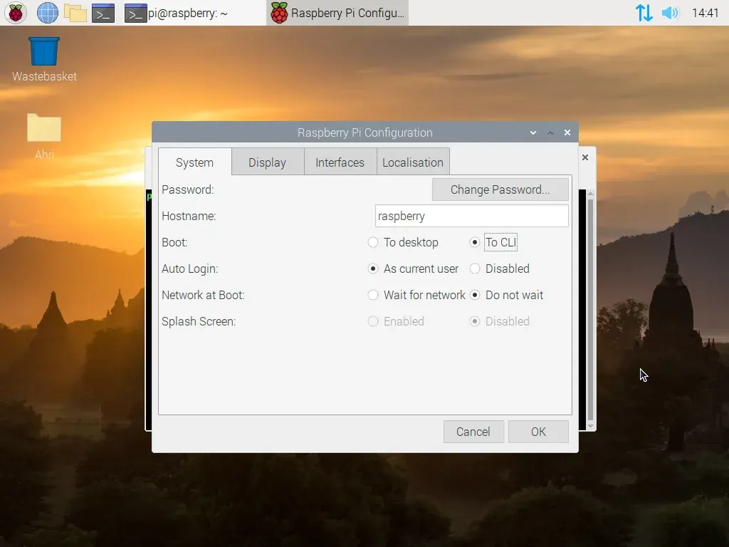 A screenshot of the Raspberry Pi OS desktop. The raspberry pi configuration menu is open in a new window, displaying a series of options. One particular option, labelled "Boot"​ has been changed from the option "To desktop"​ over to the other option available, "To C L I"​.