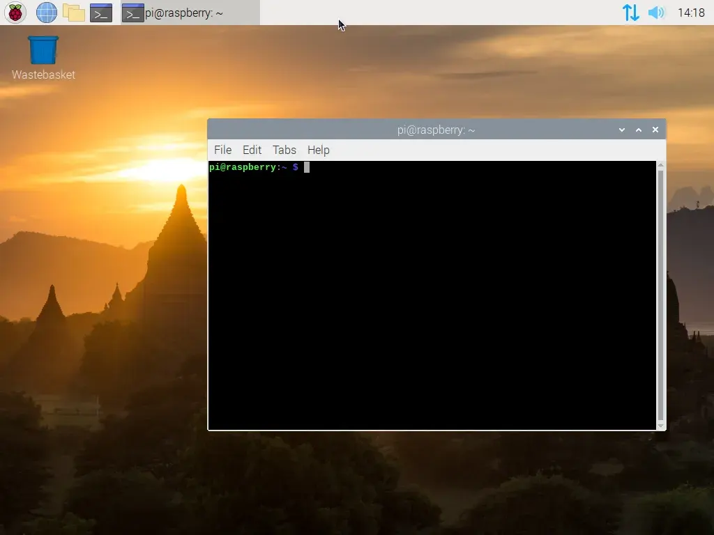 A screenshot of the Raspberry Pi OS desktop, a single window is open, which is displaying an empty terminal.